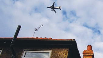 Plane over house